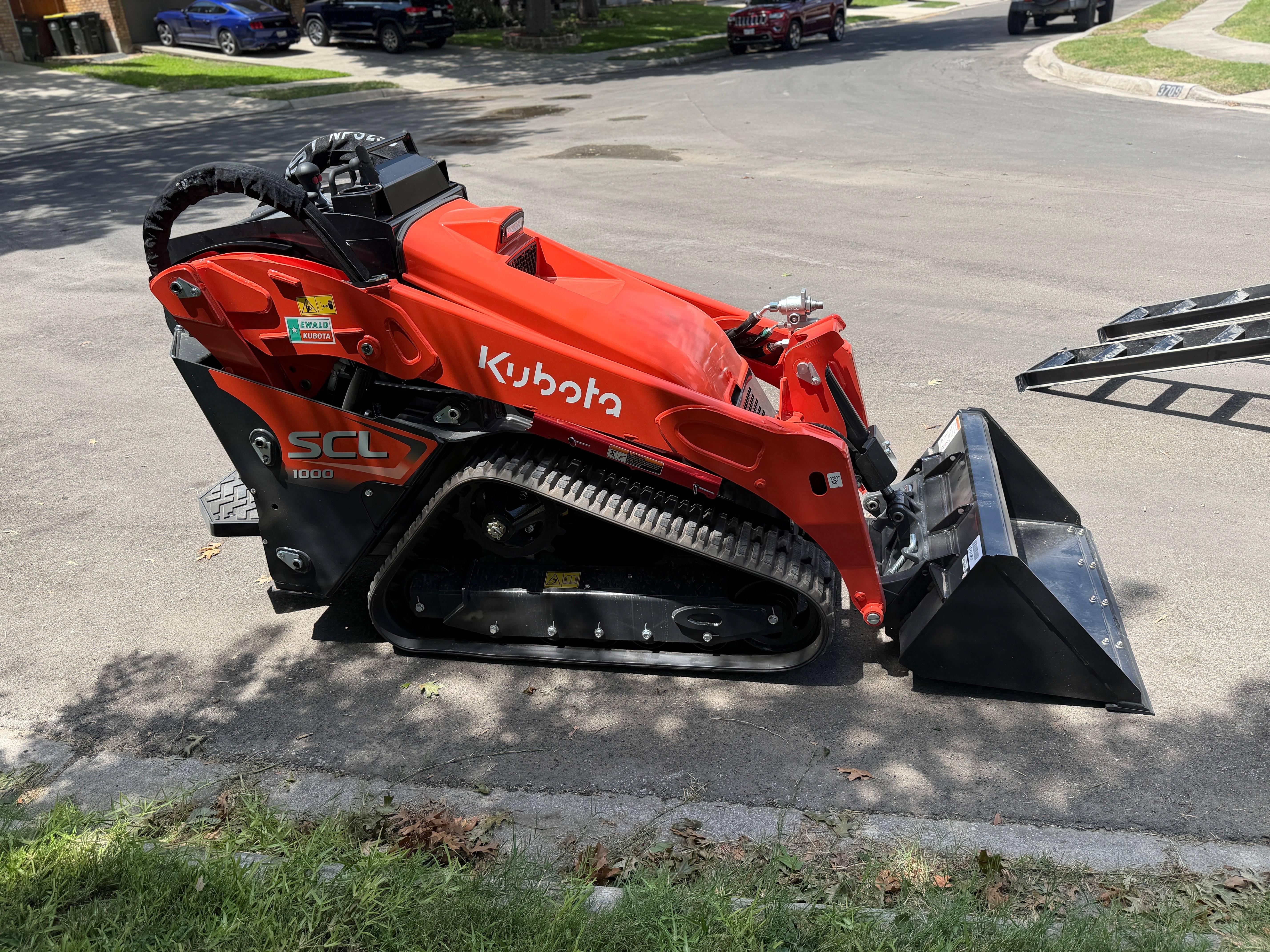 Kubota SCL1000 mini skid steer stand-on compact loader rental