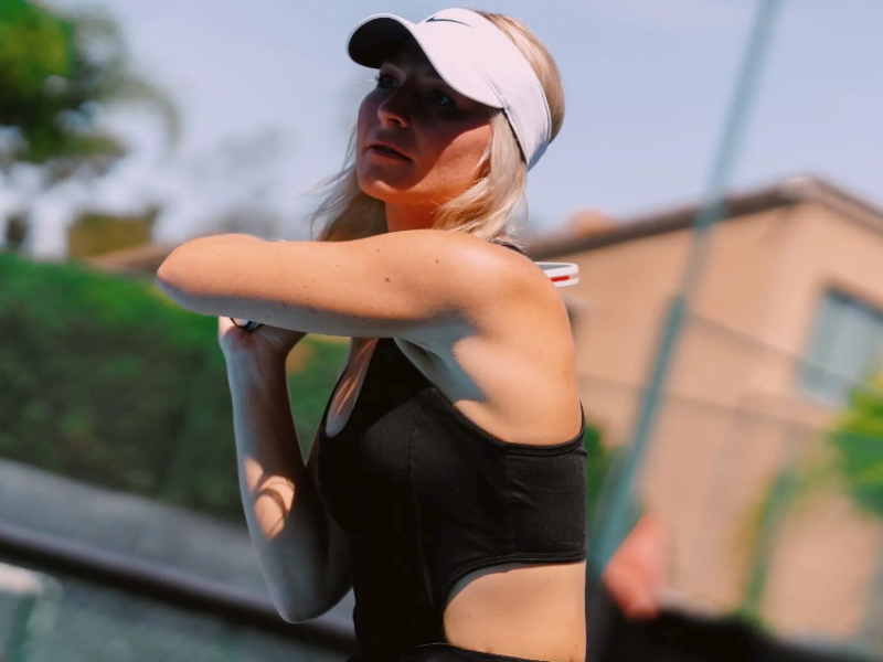 Connor playing pickleball or tennis