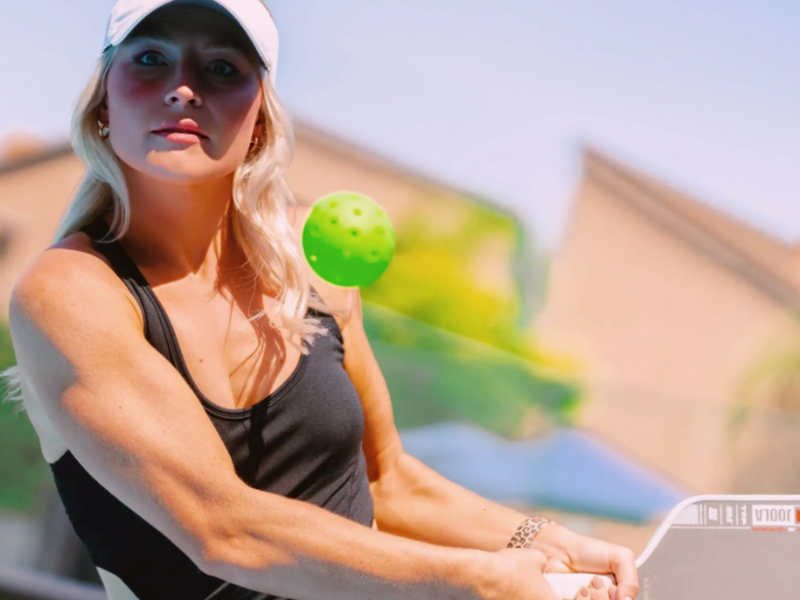 Connor playing pickleball or tennis